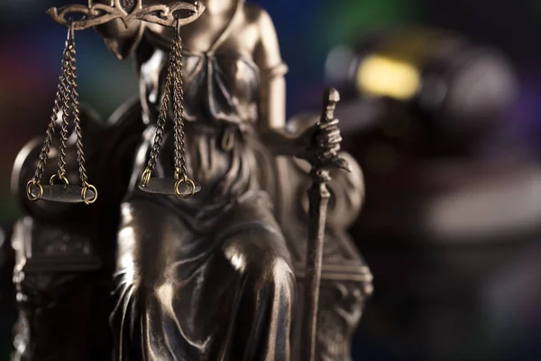 Law theme. Blind justice symbol - Themis. Bokeh background.