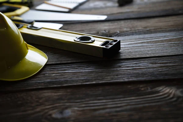 Contractor Concept Yellow Hardhat Libella Other Tools Rustic Wooden Background — ストック写真