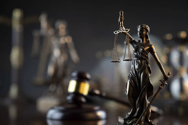 Lady Justice with balance scale and judge gavel, symbols of law