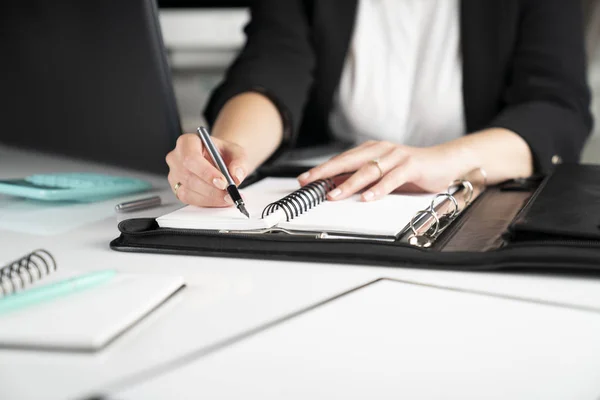 picture of woman working with papers or documents in ofiice
