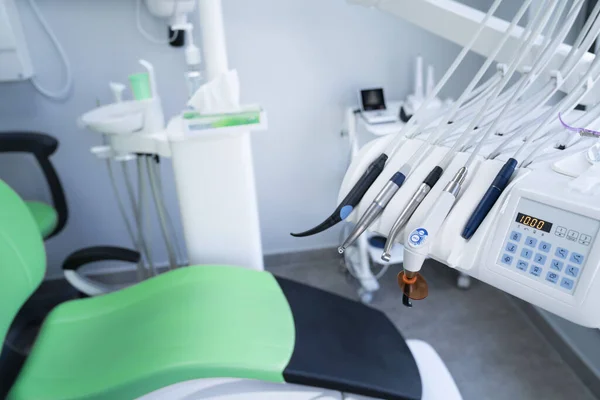 Modern dental practice. Dental chair and other accessories used by dentists.