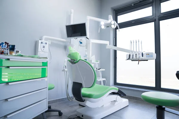 Modern dental practice. Dental chair and other accessories used by dentists.