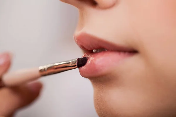 Beauty Woman Face. Make-up artist work in her studio