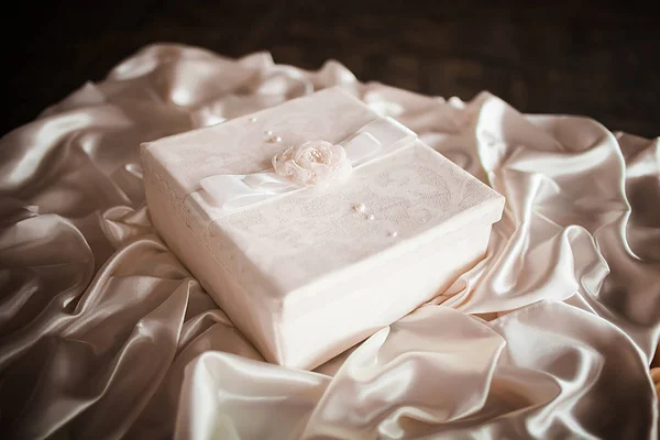 Wedding box for money. Chest and embossed decoration with a ribbon bow.