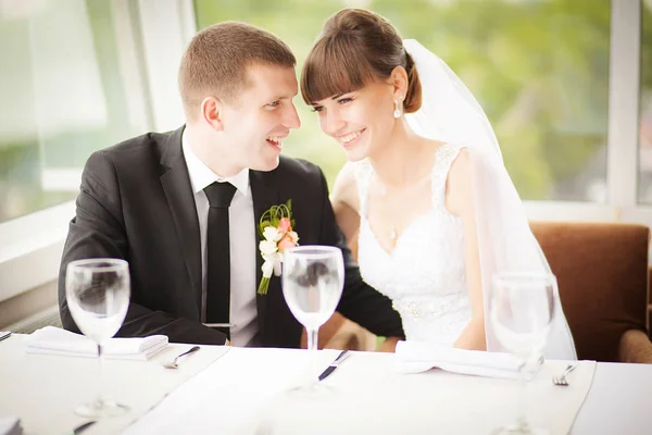 Young wedding couple in restaurant. Groom and bride together. — Stock Photo, Image