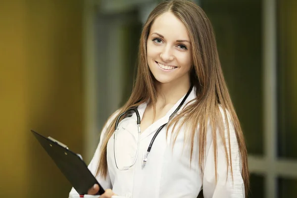 Medicine.Closeup portrait of a smiling, confident female doctor, healthcare professional with labcoat and stethoscope, arms crossed. Patient visit Health care reform. — Stock Photo, Image