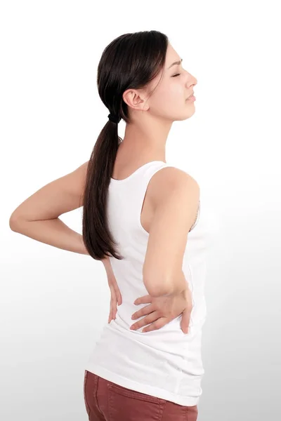 Health Issues. Closeup Of Beautiful Young Woman Having Backache, Strong Back Pain. Female Suffering From Painful Feeling In Muscles, Holding Hands On Her Body. Health Care Concept. High Resolution — Stock Photo, Image