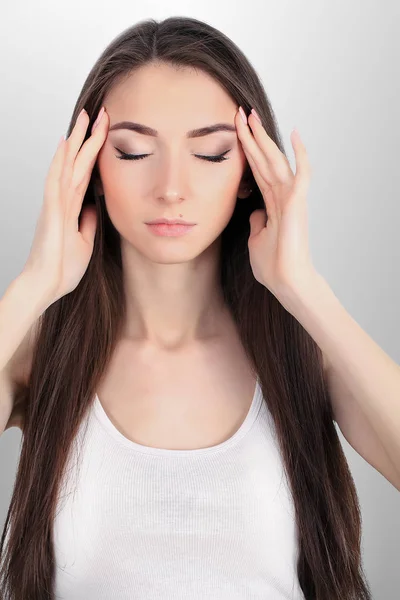 Young sad woman touch forehead and feel strong head ache