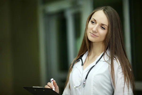 Medicine.Closeup portrait of a smiling, confident female doctor, healthcare professional with labcoat and stethoscope, arms crossed. Patient visit Health care reform. — Stock Photo, Image