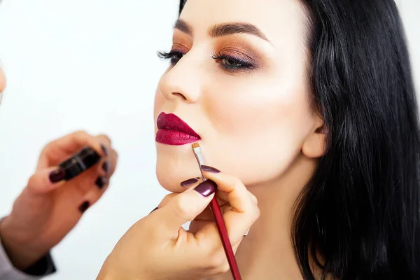 Make-up artist work in her studio.