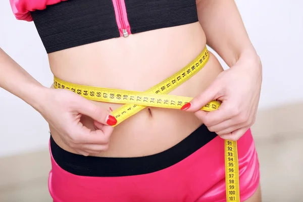 Woman measuring perfect shape of beautiful hips — Stock Photo, Image