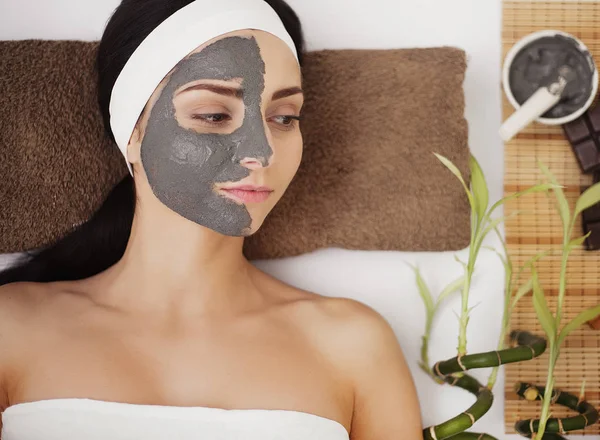 Spa Mud Mask. Woman in Spa Salon. Face Mask. Facial Clay Mask. T