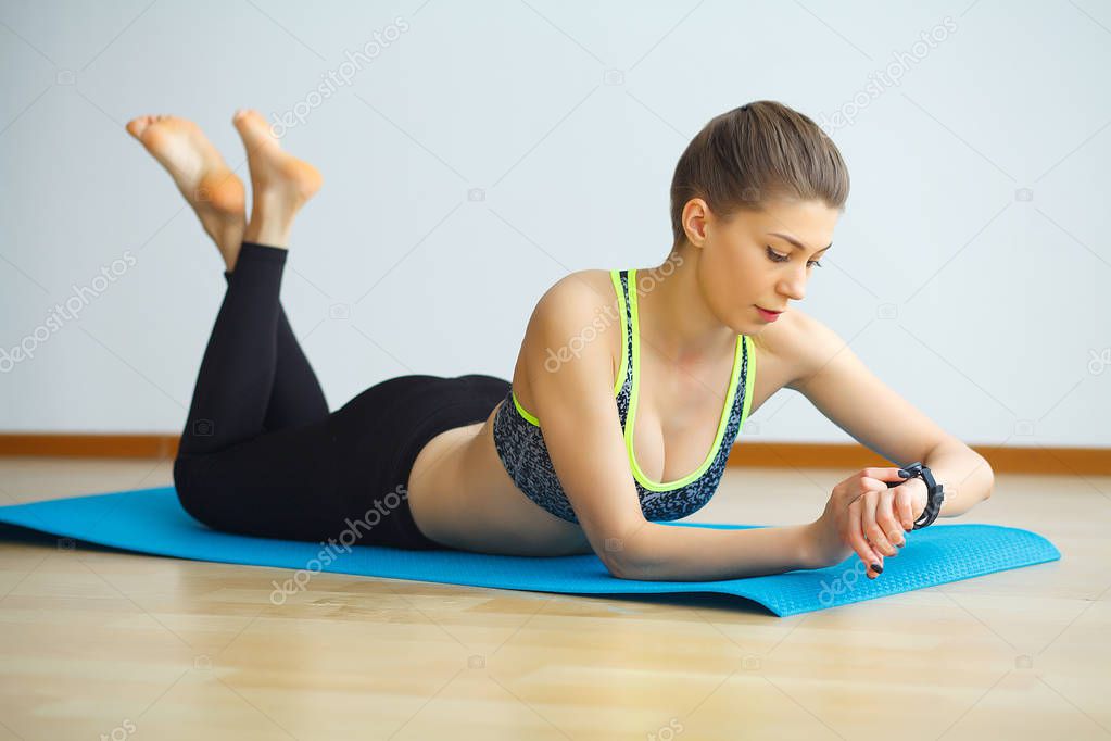 Young yogi attractive woman practicing yoga concept, wearing spo