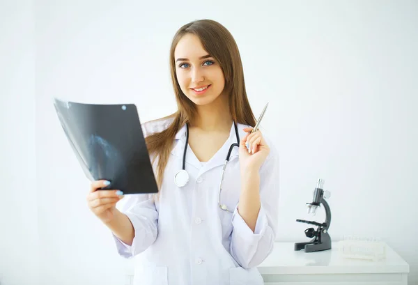 Concerned male doctor looking at x-ray — Stock Photo, Image