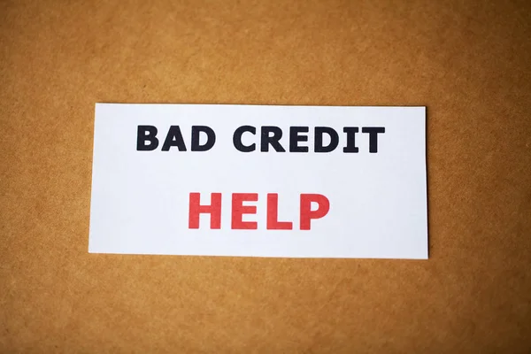 Bad credit, written on a white sheet of paper — Stock Photo, Image