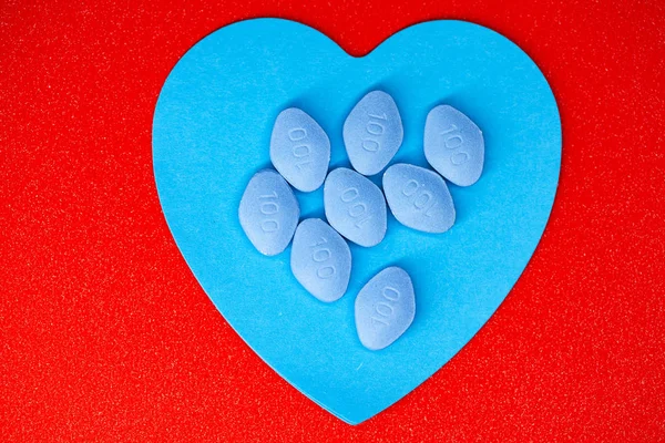 Pill for mens health and Valentine day background.