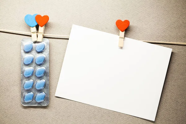 Pill for mens health and Valentine day background.