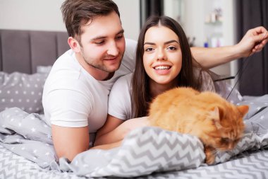 Intimate sensual young couple in bedroom enjoying each other
