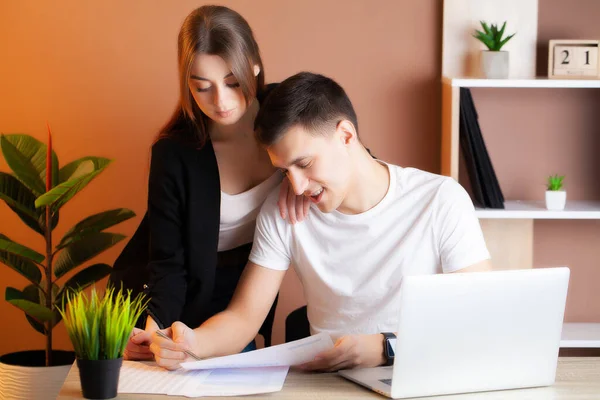 Loving couple working successfully together on their own business in the office — Stock Photo, Image