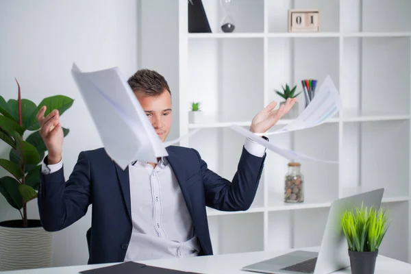 Solid businessman in a jacket works with documents in the office of the company — Stock Photo, Image