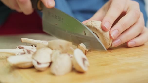 Closeup of woman slices mushrooms for diet salad. — Stock Video