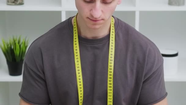 Young sports man holding a high protein meal in his hands — Stock Video