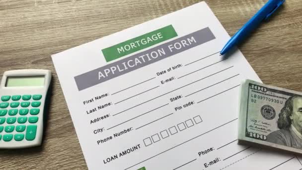 Mortgage application form on a wooden table — Stock Video