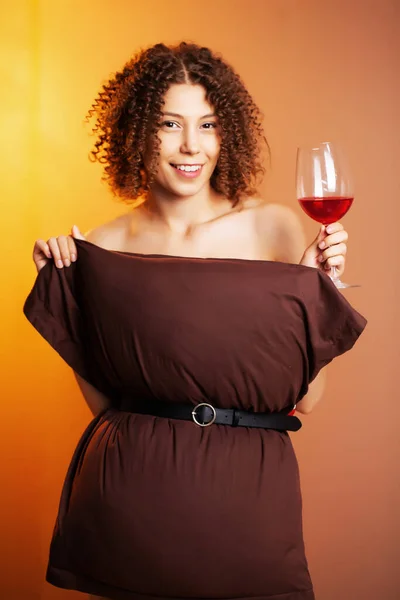 Cute woman with glass of red wine participate pillow challenge — Stock Photo, Image