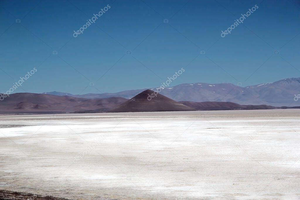 Cono de Arita in Salar of Arizaro at the Puna de Atacama, Argentina. Salar of Arizaro is a large salt flat of the Andes in north-western Argentina and it covers an area of 1600 kmq