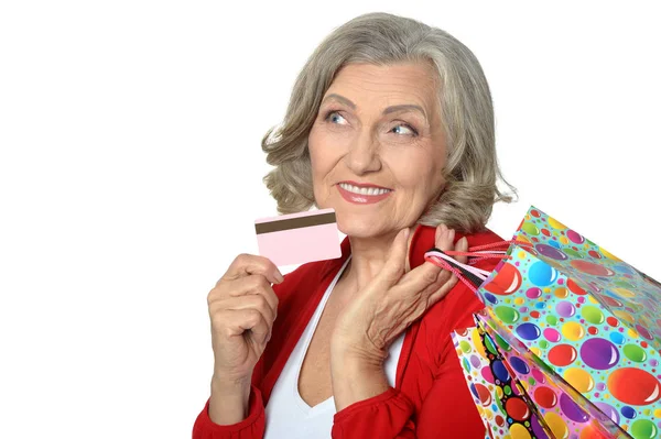 Senior woman with shopping bags — Stock Photo, Image