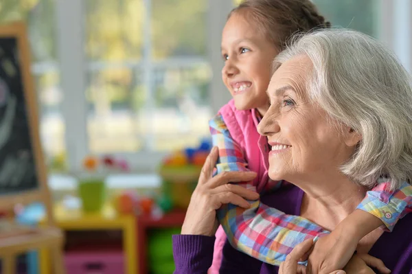 Grandmother and granddaughter hug — Stock Photo, Image