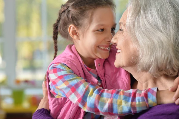 Grandmother and granddaughter hug — Stock Photo, Image
