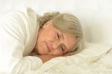 Seniour woman sleeping clipart