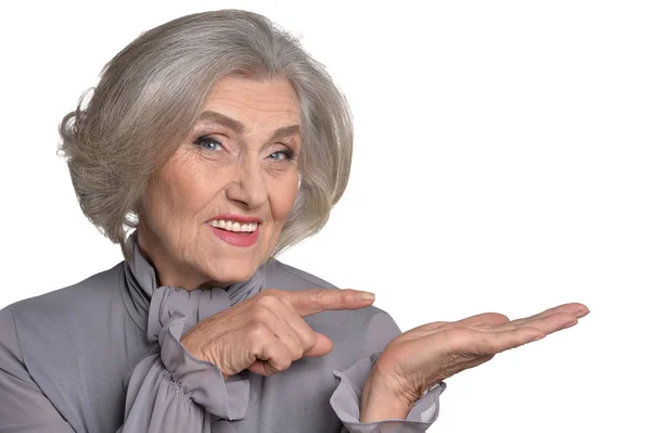 Senior woman pointing — Stock Photo, Image