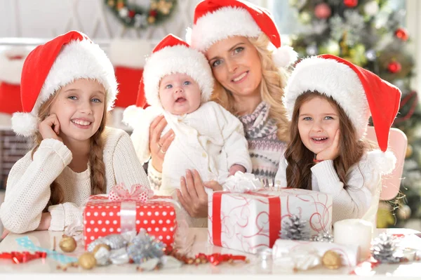 Family in Santa hats — Stock Photo, Image
