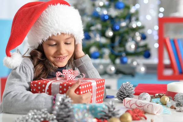 Child with Christmas present — Stock Photo, Image