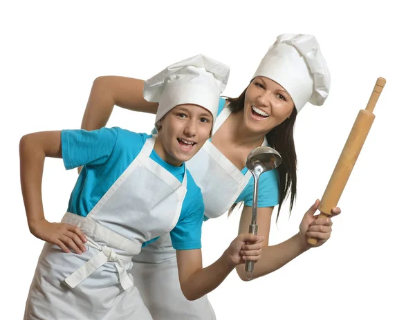 Mother and son in aprons and hats — Stock Photo, Image