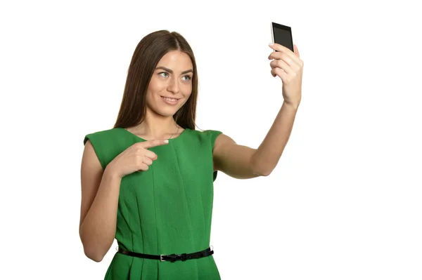 Mooie jonge vrouw in groene jurk — Stockfoto