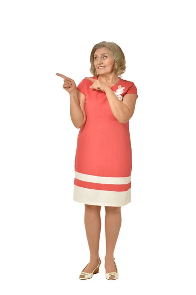 Senior woman in coral dress — Stock Photo, Image