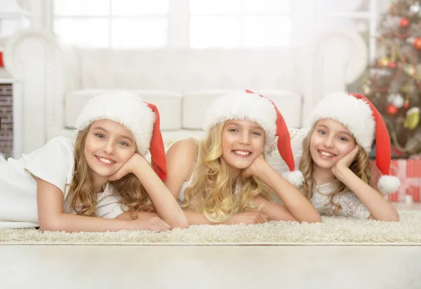 Little girls in Santa hats — Stock Photo, Image