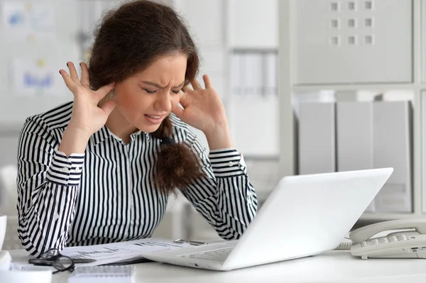 Tired woman with laptop — Stock Photo, Image