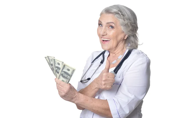 Mature female doctor with money — Stock Photo, Image