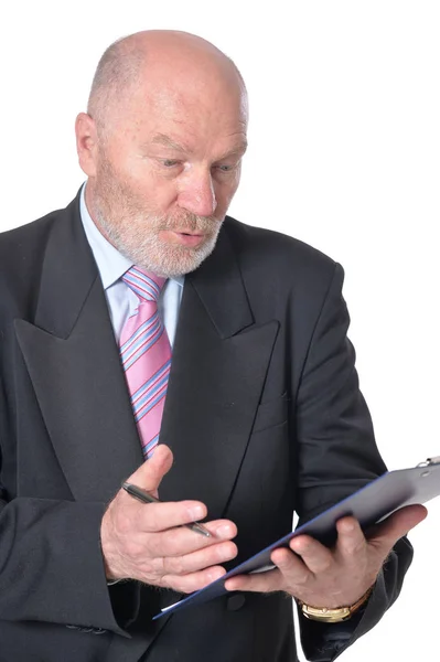 Senior businessman writing something — Stock Photo, Image