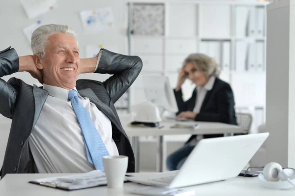 Mature couple working at office — Stock Photo, Image