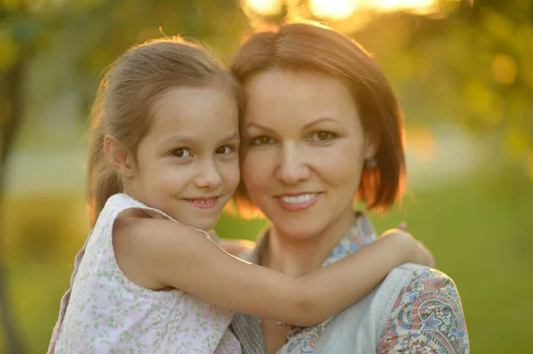 Mother holding on hands daughter — Stock Photo, Image