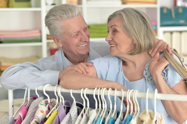 Senior couple choosing shirt — Stock Photo, Image