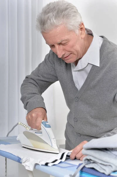 Senior man Ironing clothes — Stock Photo, Image
