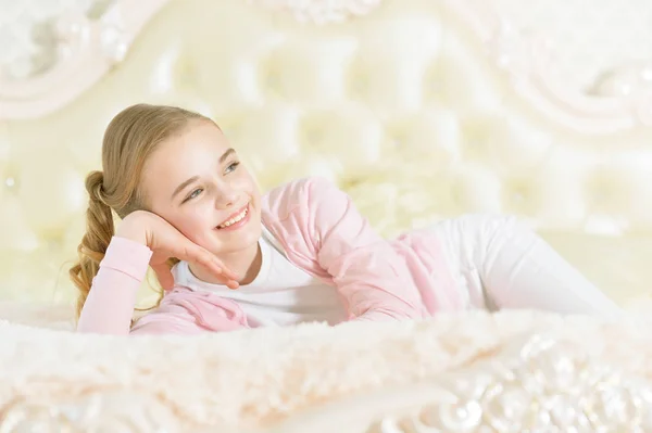 Girl lying on soft plaid — Stock Photo, Image