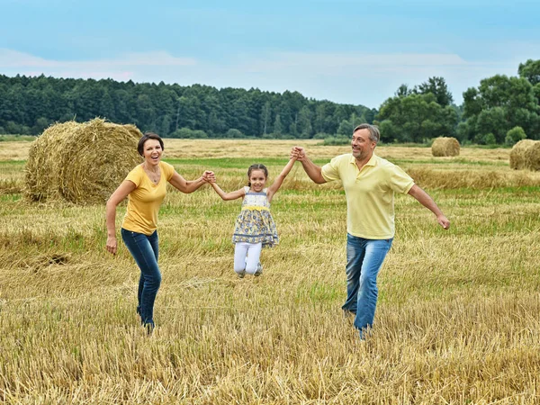 Parents having fun with daughter — Stock Photo, Image