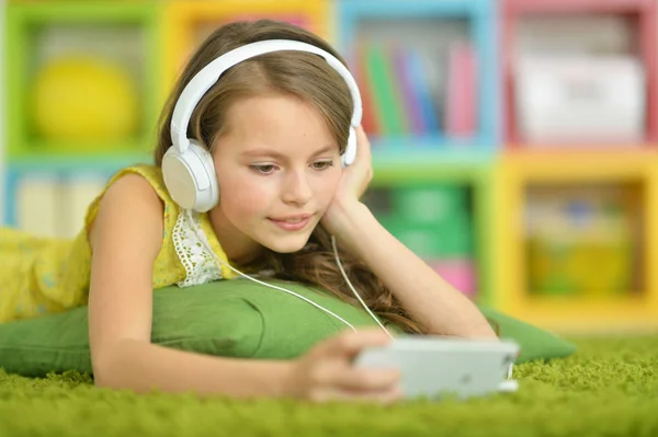 Cute little girl with headphones — Stock Photo, Image